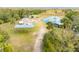 Aerial view of property showing home, pond, outbuildings, and waterfront access at 2570 Canvasback Trl, Geneva, FL 32732