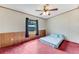Bedroom with wood paneling and a comfortable bed at 2570 Canvasback Trl, Geneva, FL 32732