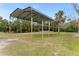 Metal carport provides covered parking or storage at 2570 Canvasback Trl, Geneva, FL 32732