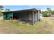 Guest house with covered patio and grassy yard at 2570 Canvasback Trl, Geneva, FL 32732