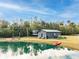 Gray guest house near a pond with kayaks and picnic area at 2570 Canvasback Trl, Geneva, FL 32732