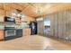 Rustic kitchen with wood cabinets and modern appliances at 2570 Canvasback Trl, Geneva, FL 32732