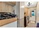 Laundry room with washer, dryer, and ample cabinet storage at 2570 Canvasback Trl, Geneva, FL 32732