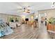 Open living space with wood-look floors and stone accent wall at 2570 Canvasback Trl, Geneva, FL 32732