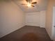 Spacious bedroom featuring carpet, a ceiling fan, and large windows at 2620 Lancaster Ct, Apopka, FL 32703