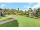 Large backyard with a shed and lush landscaping at 2647 Zuni Rd, St Cloud, FL 34771