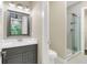 Clean bathroom with a single vanity, toilet and a glass shower at 2647 Zuni Rd, St Cloud, FL 34771