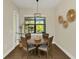 Charming dining area with a wooden table and four chairs at 2647 Zuni Rd, St Cloud, FL 34771