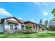 Single-story home with stone accents and a covered porch at 2647 Zuni Rd, St Cloud, FL 34771