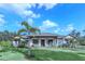 House with palm trees and lush lawn at 2647 Zuni Rd, St Cloud, FL 34771