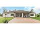 House exterior with a screened patio and brick pavers at 2647 Zuni Rd, St Cloud, FL 34771