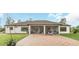 House exterior with a screened patio and brick pavers at 2647 Zuni Rd, St Cloud, FL 34771
