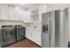 Laundry room with washer, dryer, and extra storage at 2647 Zuni Rd, St Cloud, FL 34771