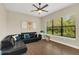Relaxing living room featuring a comfortable sectional sofa and large window at 2647 Zuni Rd, St Cloud, FL 34771