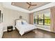 Main bedroom with large window, wood flooring and ceiling fan at 2647 Zuni Rd, St Cloud, FL 34771