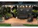 Evening view of a covered patio with string lights and comfortable seating at 2647 Zuni Rd, Saint Cloud, FL 34771