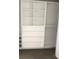Spacious walk-in closet with white custom shelving and drawers at 2647 Zuni Rd, St Cloud, FL 34771