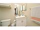 Well-lit bathroom with a single sink vanity, neutral walls and tile flooring at 2740 Maitland Crossing Way # 1, Orlando, FL 32810