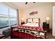 Inviting bedroom with a decorative metal bed frame, cozy bedding and plenty of natural light at 2740 Maitland Crossing Way # 1, Orlando, FL 32810