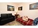 Bright bedroom showcasing unique nebula wall art, daybed and black love seat at 2740 Maitland Crossing Way # 1, Orlando, FL 32810
