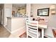 Cozy dining area features a breakfast bar, seating for four, and neutral colors for a warm atmosphere at 2740 Maitland Crossing Way # 1, Orlando, FL 32810