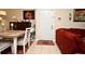 Inviting living area featuring a red sofa and front door at 2740 Maitland Crossing Way # 1, Orlando, FL 32810