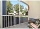 Enclosed patio area with outdoor seating, a table, and a view of the yard at 2740 Maitland Crossing Way # 1, Orlando, FL 32810