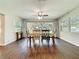 Bright dining room featuring hardwood floors and access to the backyard at 30722 Cove Rd, Tavares, FL 32778