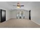 Spacious bedroom with ceiling fan and neutral carpet at 35234 Haines Creek Rd, Leesburg, FL 34788