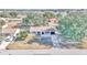 Aerial view of a single-story house with a large yard and lake nearby at 37 Hickory Track Way, Ocala, FL 34472
