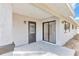 Cozy back patio with sliding glass doors and exterior door at 37 Hickory Track Way, Ocala, FL 34472