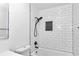 Clean bathroom with white subway tile and a black shower fixture at 37 Hickory Track Way, Ocala, FL 34472