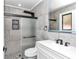 Modern bathroom with walk-in shower, pebble floor, and updated vanity at 37 Hickory Track Way, Ocala, FL 34472