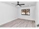 Bright bedroom with wood-look flooring and a ceiling fan at 37 Hickory Track Way, Ocala, FL 34472