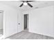 Spacious bedroom with grey flooring and an ensuite bathroom at 37 Hickory Track Way, Ocala, FL 34472