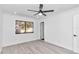 Bright bedroom with wood-look flooring and a ceiling fan at 37 Hickory Track Way, Ocala, FL 34472