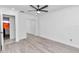 Bedroom with mirrored closet doors and wood-look flooring at 37 Hickory Track Way, Ocala, FL 34472