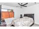 Comfortable bedroom with a queen bed and ceiling fan at 37 Hickory Track Way, Ocala, FL 34472