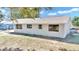 Newly renovated home exterior with fresh coat of paint at 37 Hickory Track Way, Ocala, FL 34472
