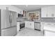 Modern kitchen with stainless steel appliances and white cabinetry at 37 Hickory Track Way, Ocala, FL 34472