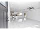 Bright and airy living room with marble floors and a view to the kitchen at 37 Hickory Track Way, Ocala, FL 34472