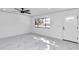 Spacious living room featuring marble flooring and a modern interior at 37 Hickory Track Way, Ocala, FL 34472