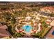 Aerial view of resort community with pools, palm trees, and buildings at 3715 Calabria Ave # 0, Davenport, FL 33897