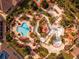 Drone shot of resort pool area with surrounding landscaping and walkways at 3715 Calabria Ave # 0, Davenport, FL 33897