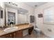 Bathroom with granite countertop, large mirror and shower at 3715 Calabria Ave # 0, Davenport, FL 33897