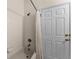 Clean bathroom with shower/tub combo and white tile at 3715 Calabria Ave # 0, Davenport, FL 33897