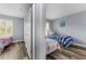 Two twin beds in a shared bedroom with gray walls and wood flooring at 3715 Calabria Ave # 0, Davenport, FL 33897