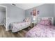 Twin bedroom with unicorn bedding and gray walls at 3715 Calabria Ave # 0, Davenport, FL 33897