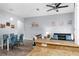 Combined dining and living area with glass table and four blue chairs at 3715 Calabria Ave # 0, Davenport, FL 33897