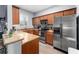 L-shaped kitchen with stainless steel appliances and granite countertops at 3715 Calabria Ave # 0, Davenport, FL 33897